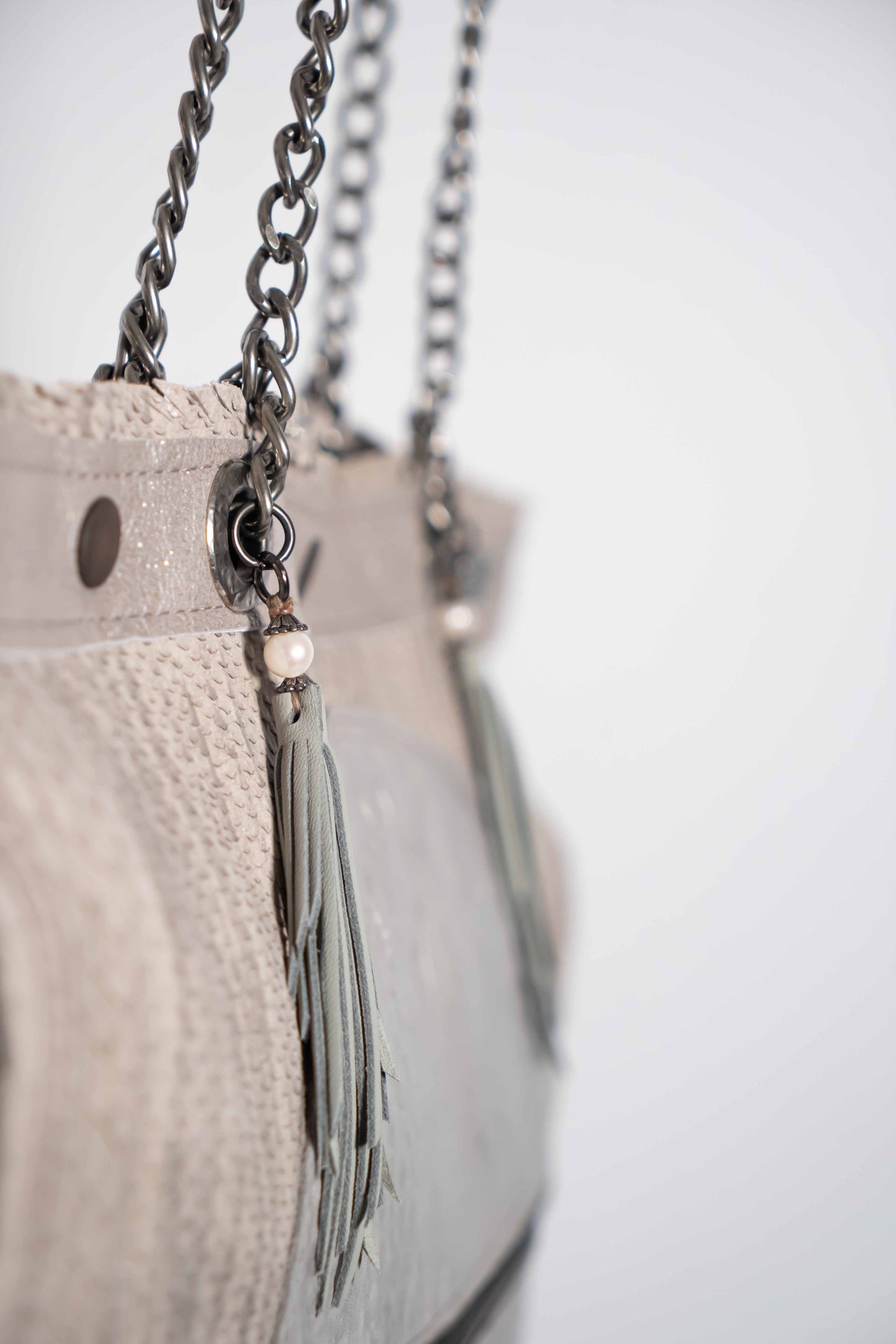 Handmade textured grey leather shopping bag with chain and leather straps.