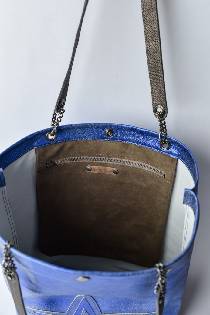 Large metallic blue handmade leather tote bag with star design and front pocket