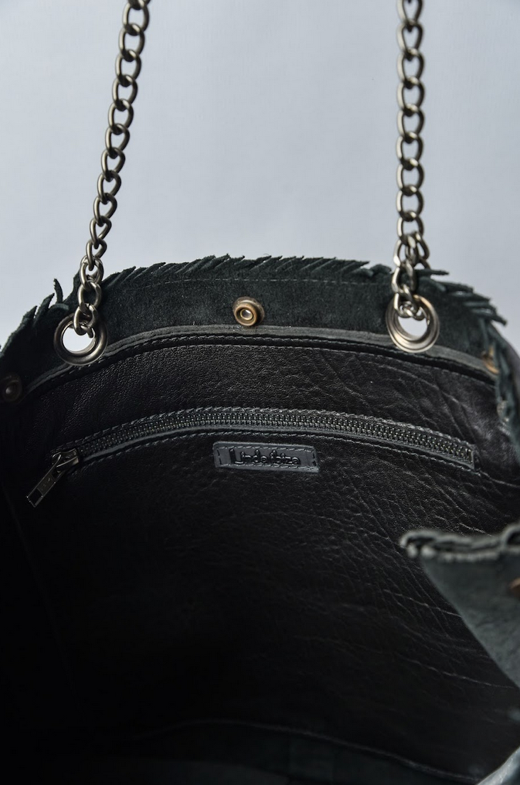 Spacious interior of the black leather shopper bag featuring a zip pocket and secure strap.