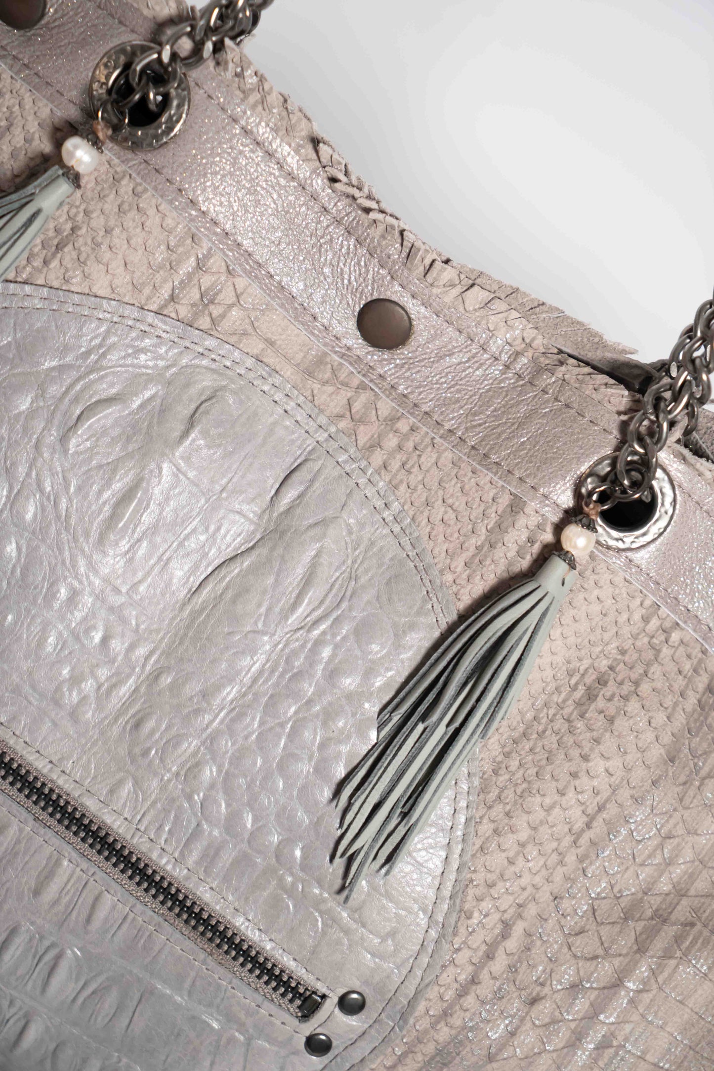 Handmade textured grey leather shopping bag with chain and leather straps.