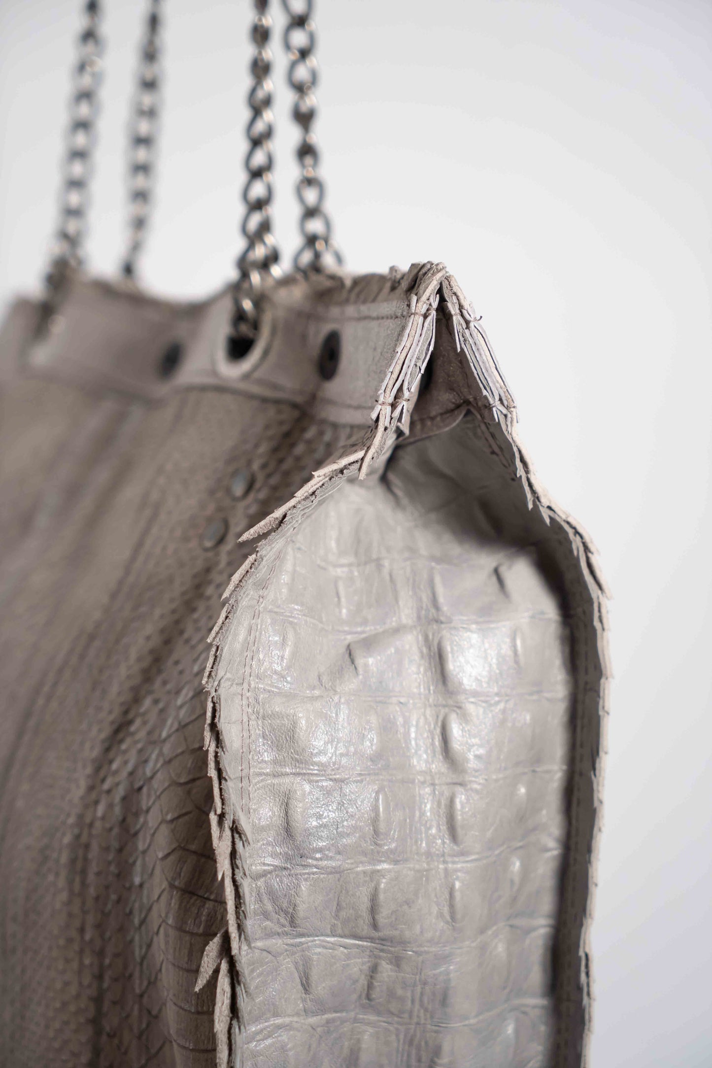 Handmade textured grey leather shopping bag with chain and leather straps.