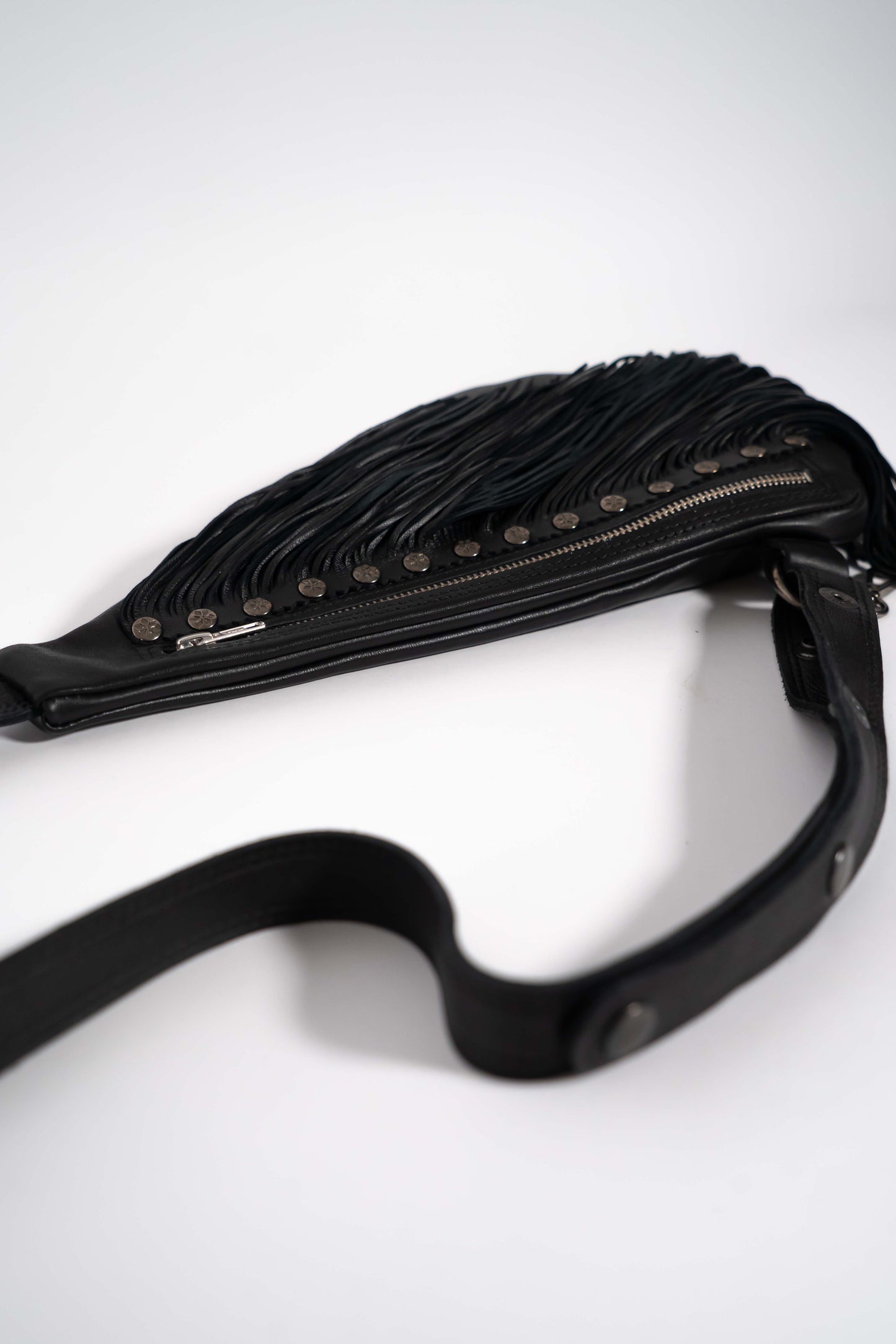 Handmade black leather sling bag with fringes - left or right side options