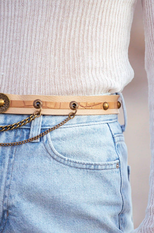 Premium cowhide leather belt in golden beige, versatile accessory for dresses and boho outfits.