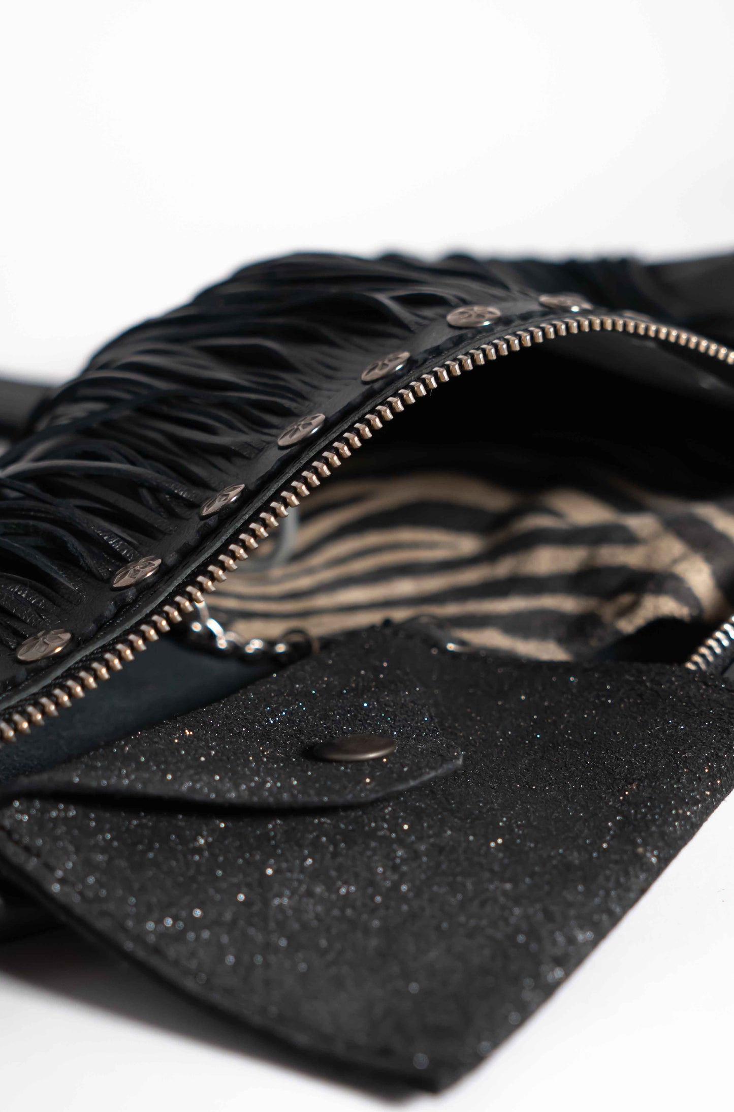 Handmade black leather sling bag with fringes - left or right side options