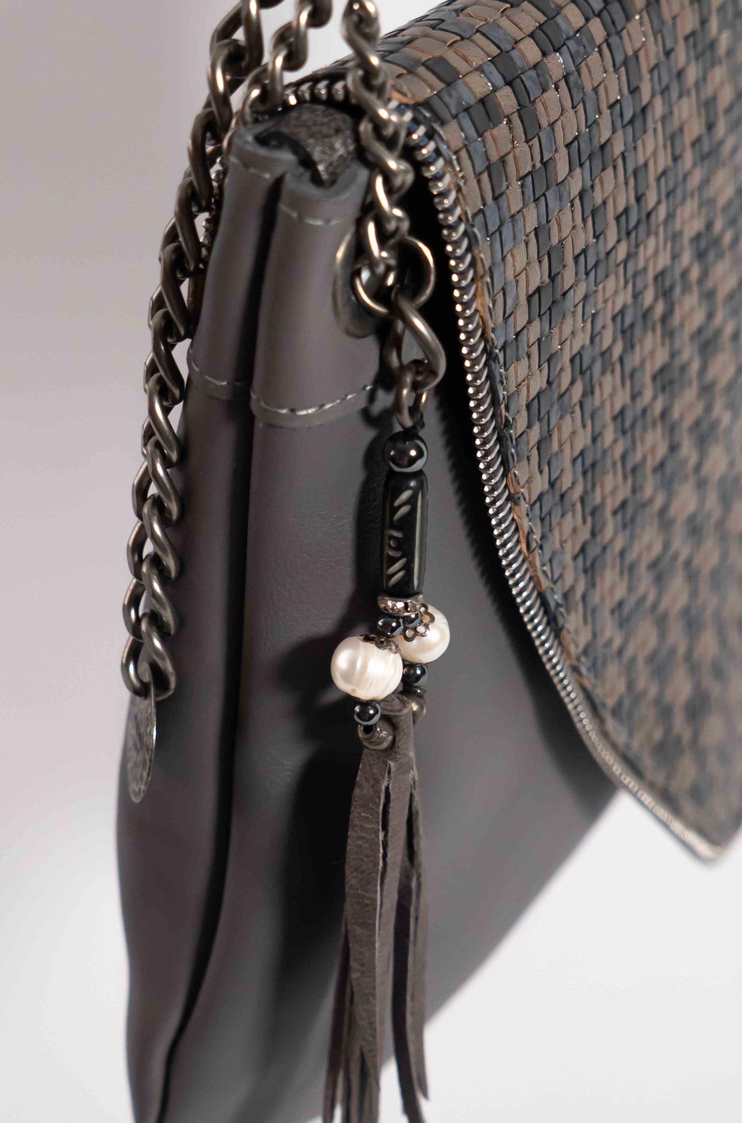 Grey handmade leather V handbag with woven leather crosshatch detail