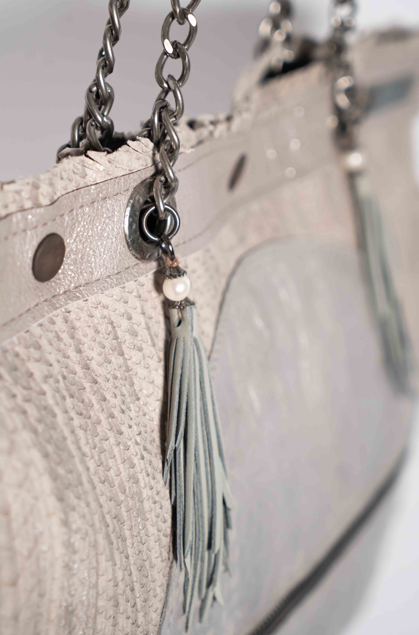 Handmade textured grey leather shopping bag with chain and leather straps.