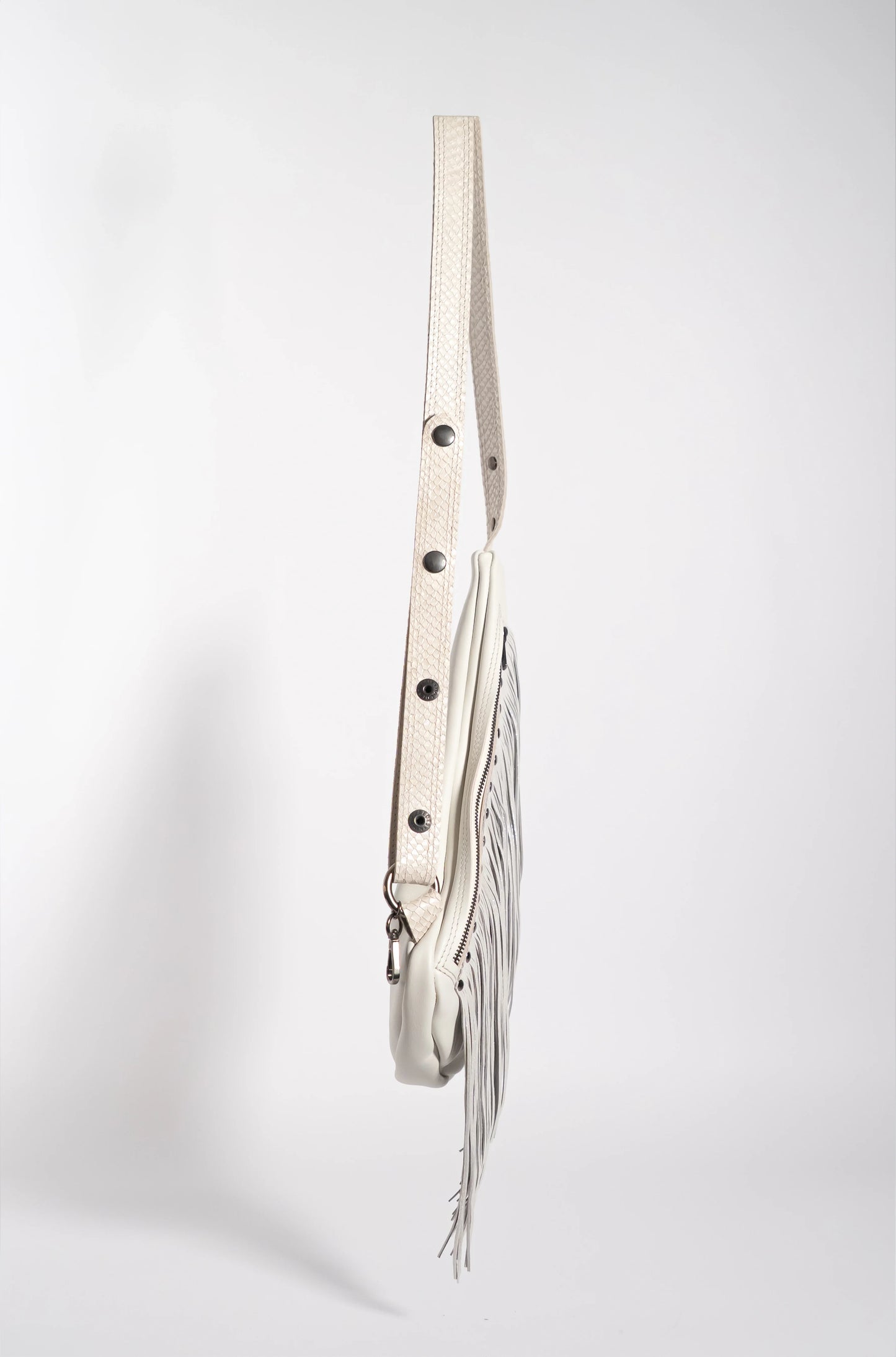 Handmade white leather sling bag with fringes