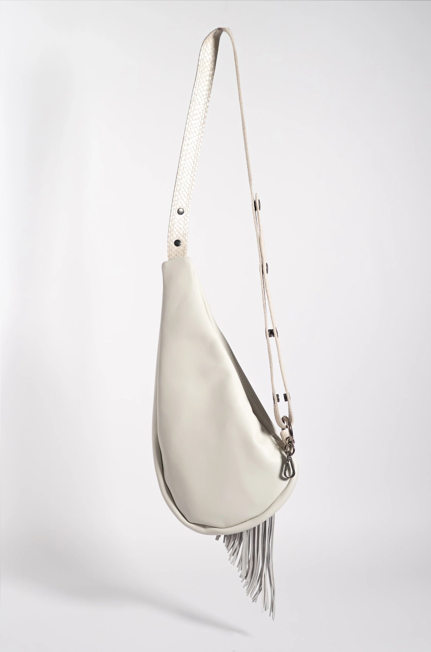 Handmade white leather sling bag with fringes
