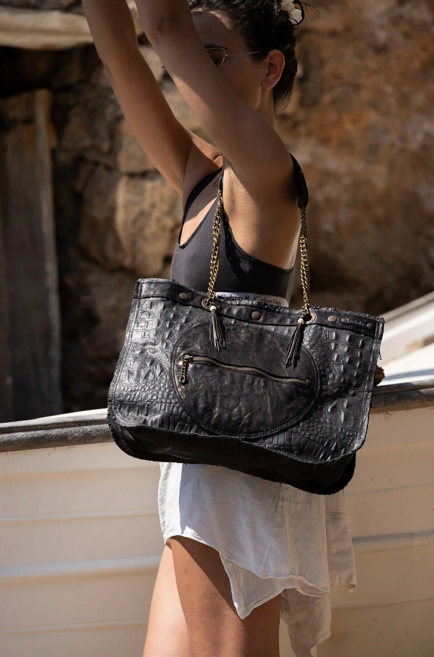 Premium black leather tote bag with crocodile texture and chain handles, handcrafted in Ibiza by Linda Ibiza Design.